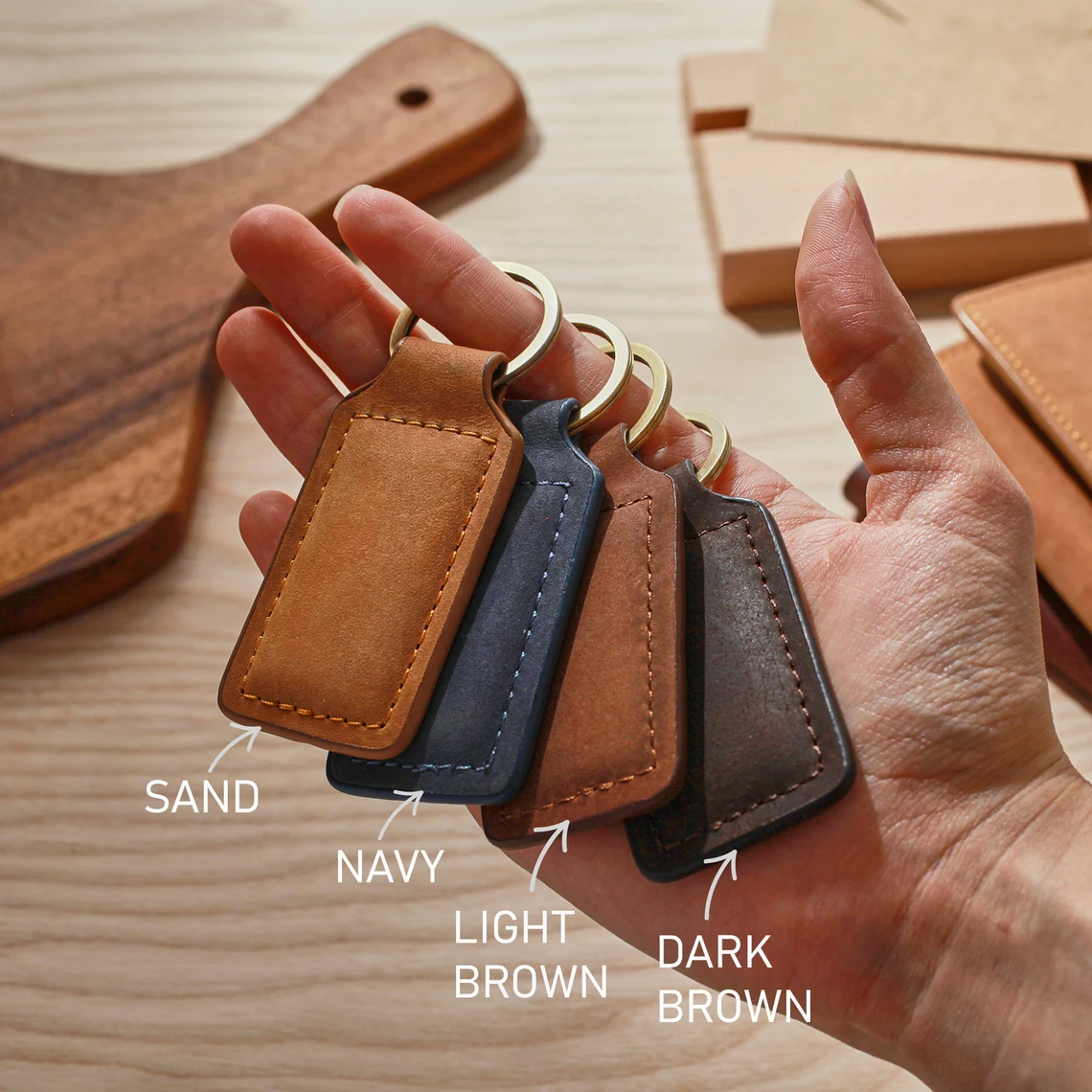 Color options for personalized leather keychains in sand, navy, light brown, and dark brown | Mrs Gift