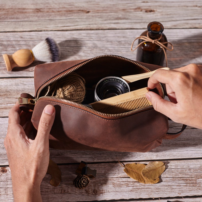 Spacious interior of personalized leather dopp kit filled with grooming tools | Mrs Gift